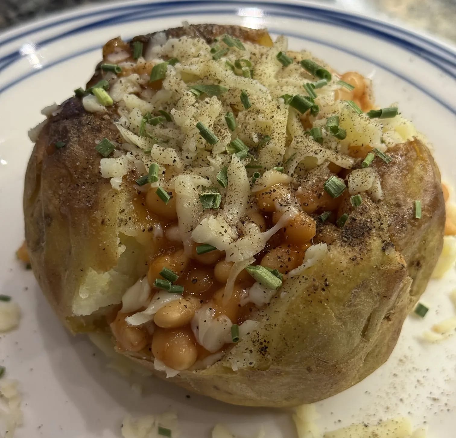 Loaded jacket potato with melted cheese and toppings at Cafe Vera Edinburgh